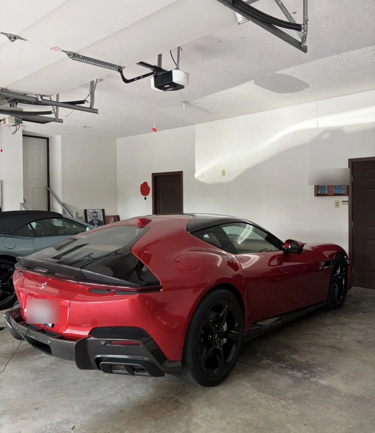 Rear three quarter view of a red 2026 Ferrari 12 Cilindri after a ceramic maintenance wash by David's Auto Spa in Festus, Missouri