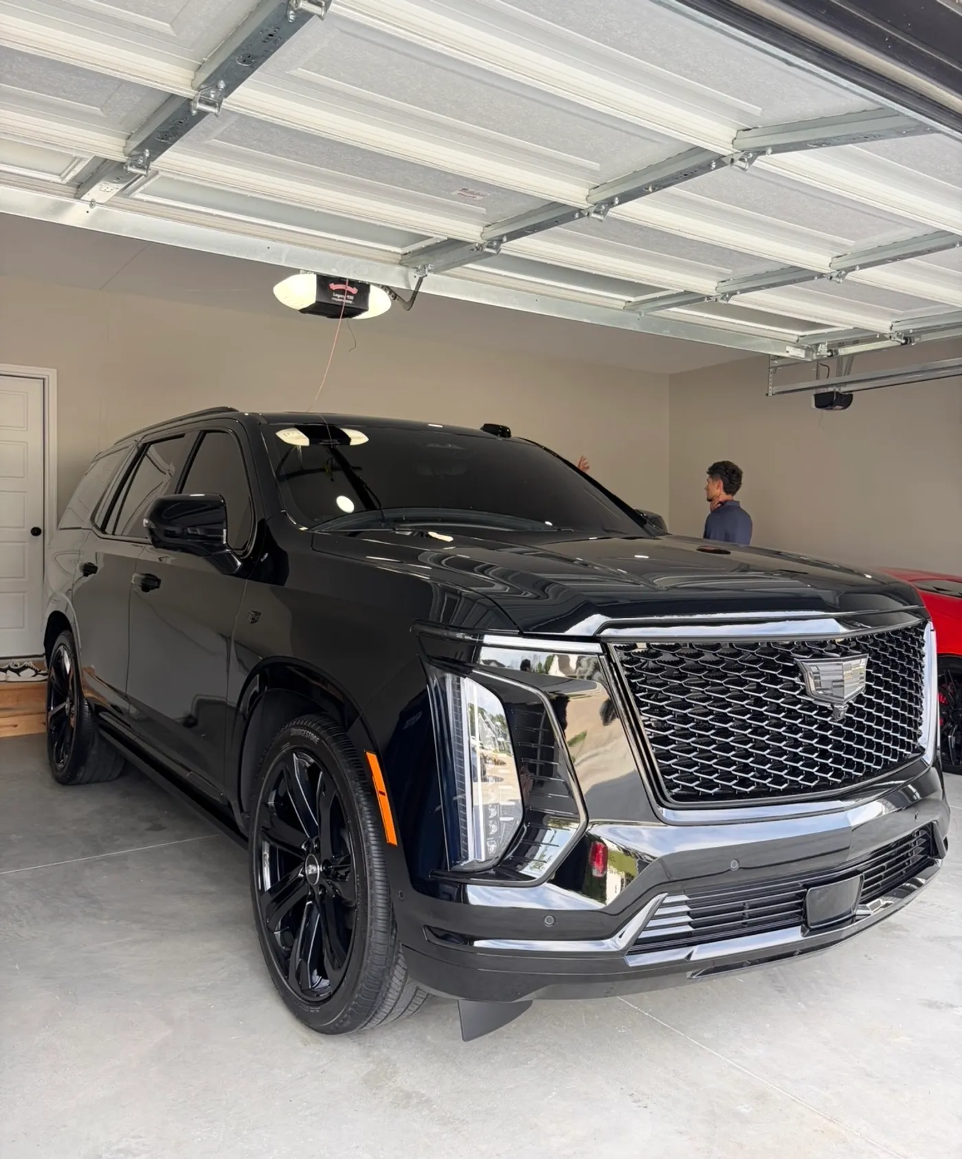 Front three quarter view of a black 2026 Cadillac Escalade after a 5-year graphene ceramic coating by David's Auto Spa in Eureka, Missouri